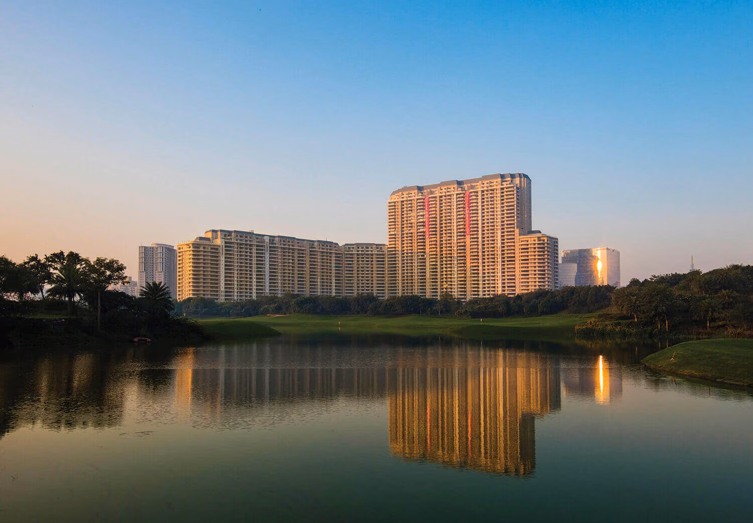 DLF The Camellias towers seen across the golf course lake, Golf Course Road, Gurgaon